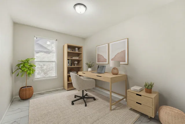 a living room with furniture and flowers