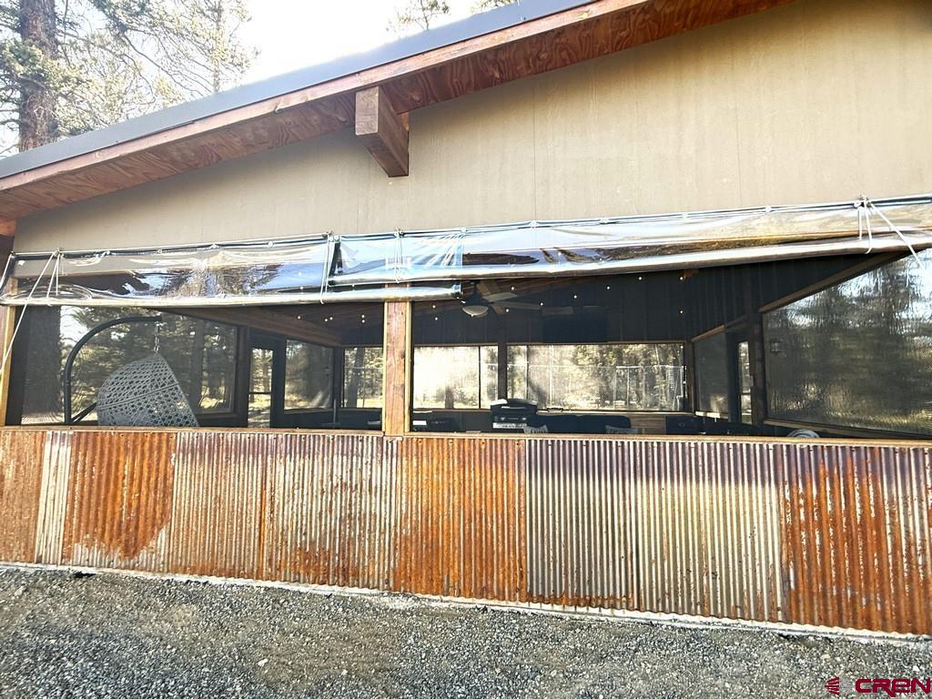 5333 Oso Creek Road Powderhorn, CO 81243 - Photo 9 of 18 a view of a house with a balcony