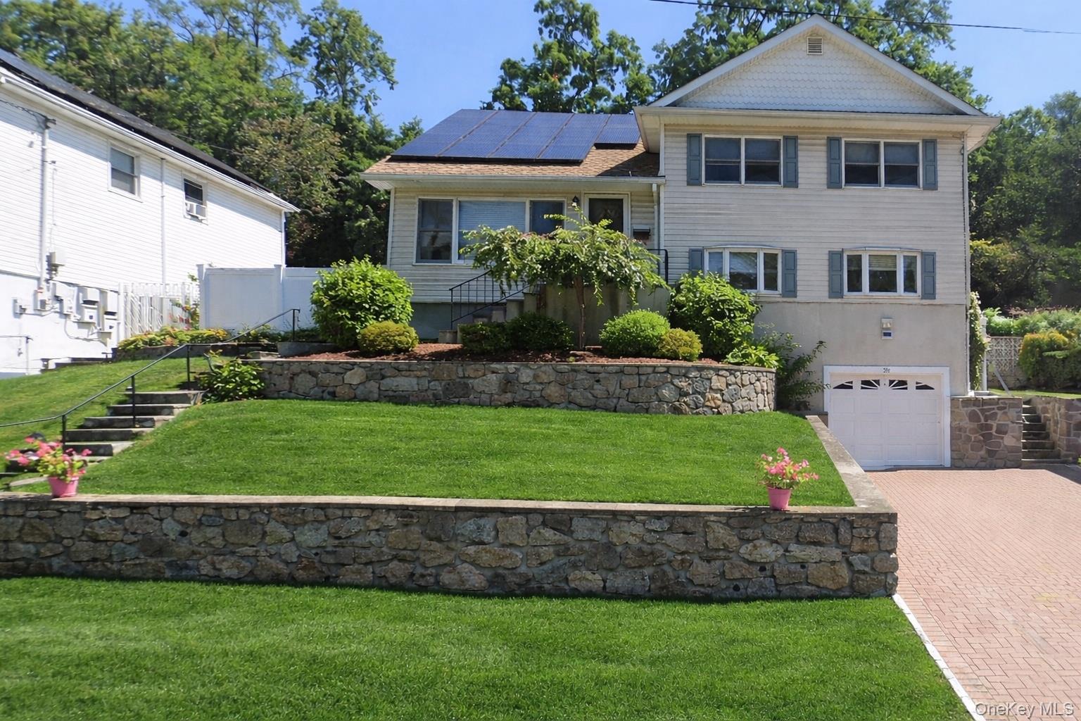 26 Dexter Road Yonkers, NY 10710 - Photo 1 of 1 Beautifully maintained front exterior with manicured grounds.Photo has been digitally enhanced.