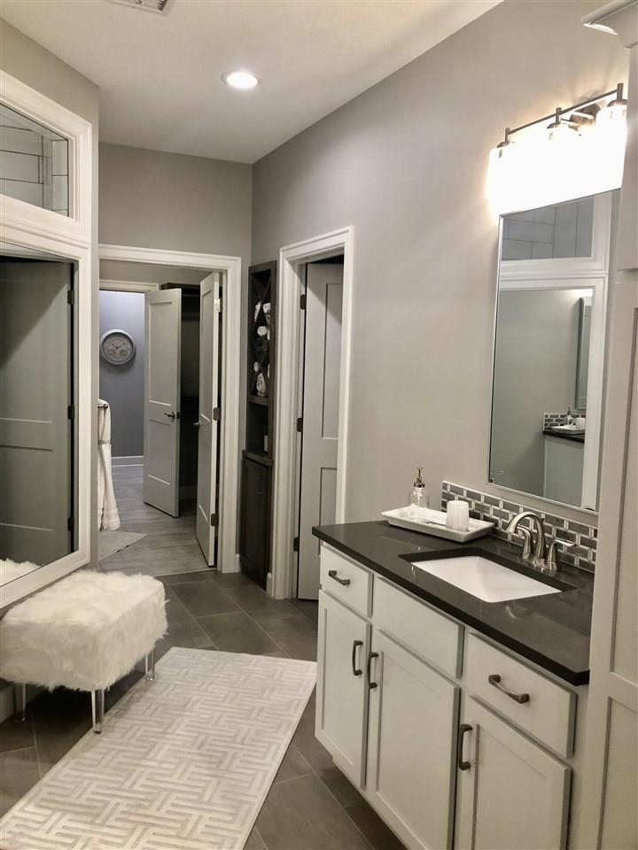 3913 North Solano Street Wichita, KS 67205 - Photo 14 of 25 Master Bath with separate dual vanities, enormous zero entry custom shower, and custom linen storage
