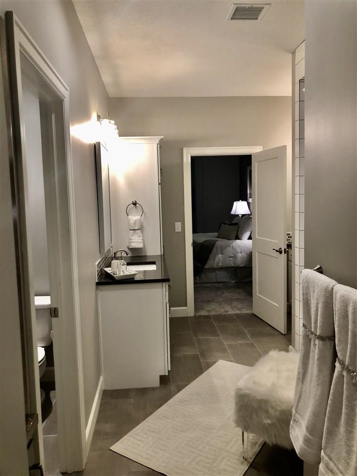 3913 North Solano Street Wichita, KS 67205 - Photo 15 of 25 Master bath looking from end of laundry room through the master bath towards master bedroom