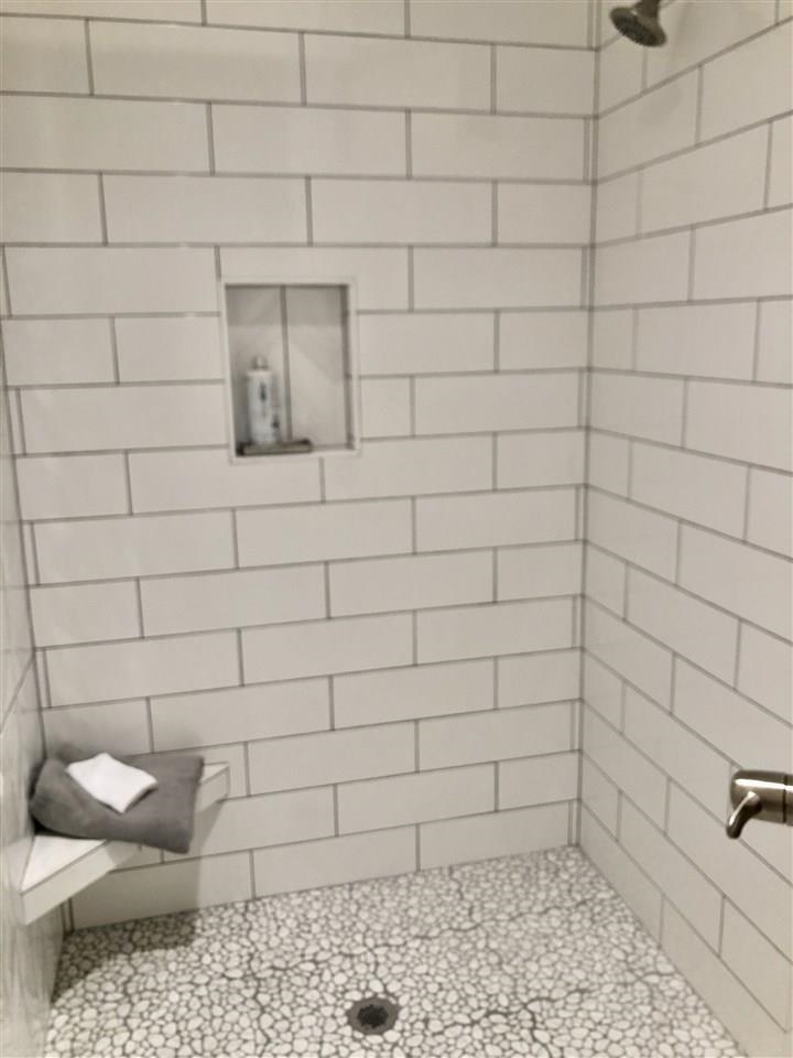 3913 North Solano Street Wichita, KS 67205 - Photo 17 of 25 Zero entry oversize custom tile walk in shower