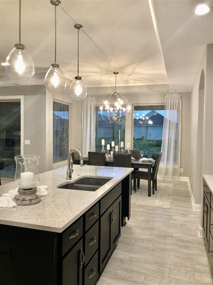 3913 North Solano Street Wichita, KS 67205 - Photo 5 of 25 Kitchen view towards dining room with views towards water ways and nature in backyard