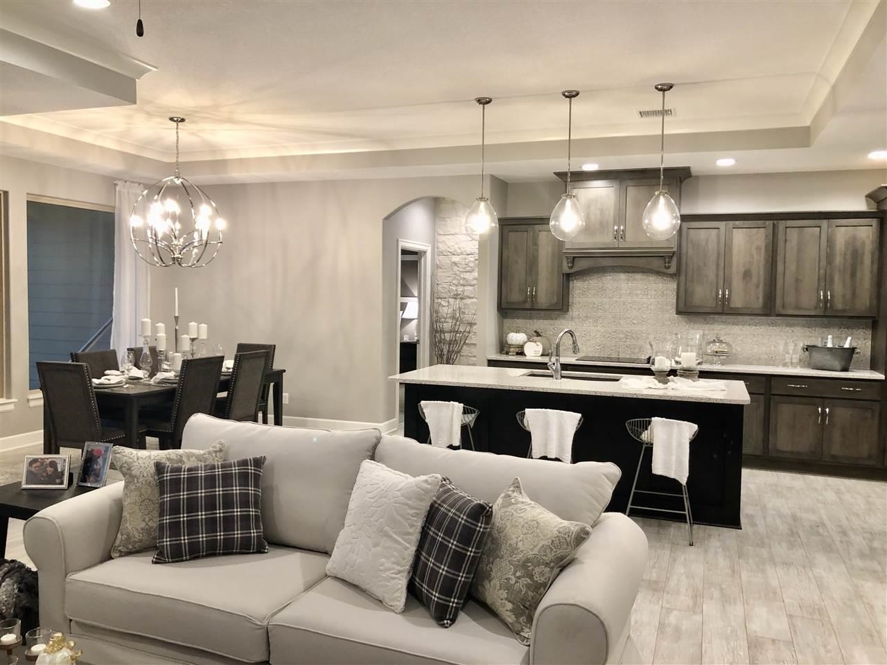 3913 North Solano Street Wichita, KS 67205 - Photo 7 of 25 View from living room towards kitchen and dining, then headed into master bedroom