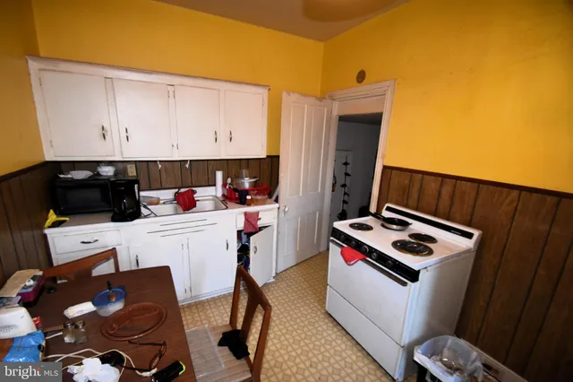 a room with furniture and white walls