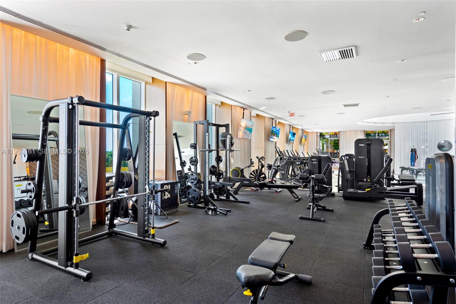 450 Alton Road, Unit 3208 Miami Beach, FL 33139 - Photo 22 of 48 a view of a room with gym equipment