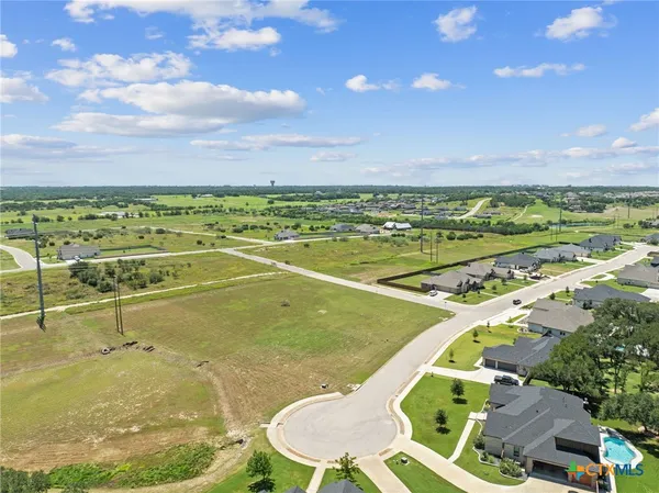 a view of a swimming pool and an outdoor seating