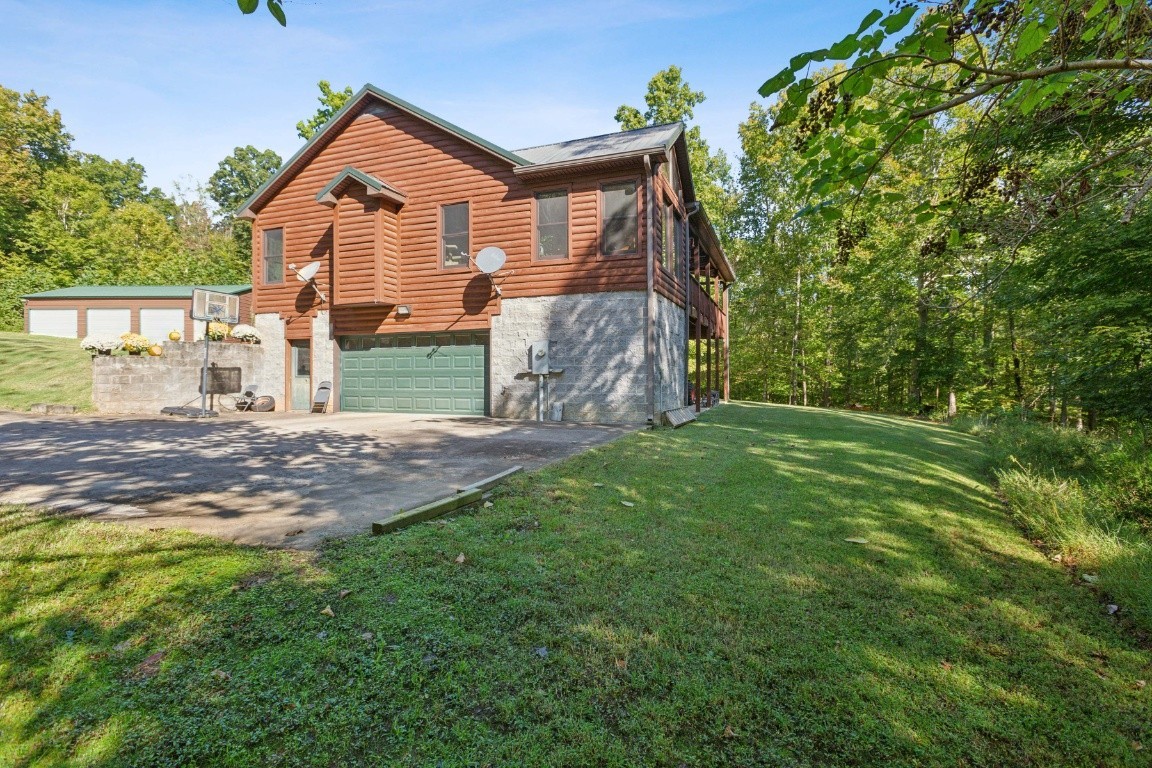 4455 Tarsus Road Palmyra, TN 37142 - Photo 11 of 38 front view of a house with a yard