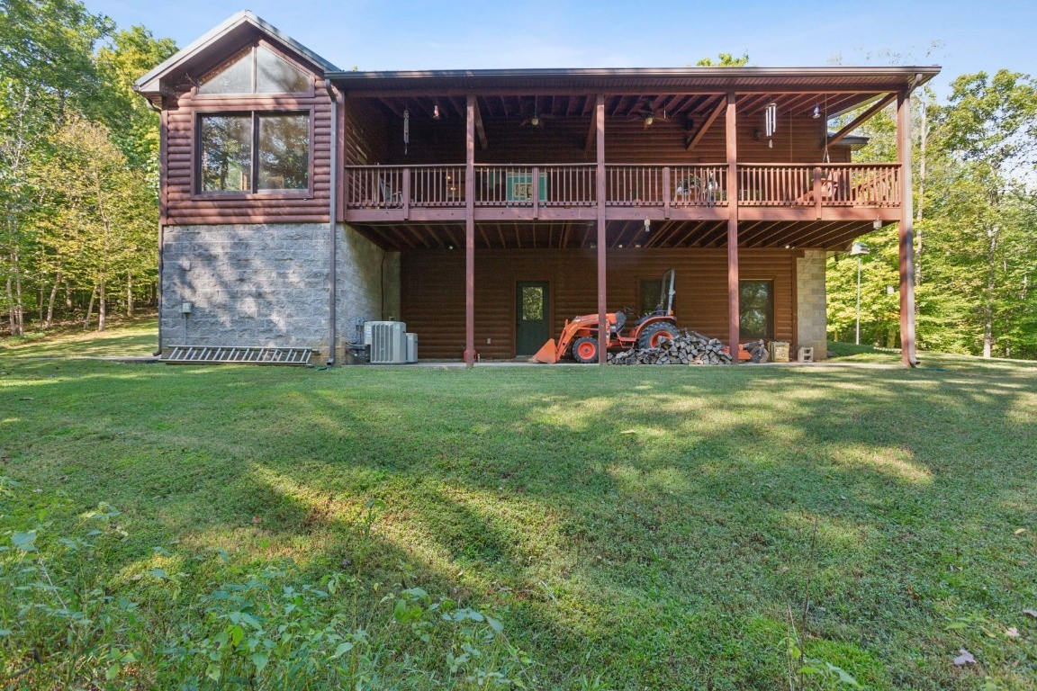 4455 Tarsus Road Palmyra, TN 37142 - Photo 12 of 38 a view of a house with a yard and sitting area