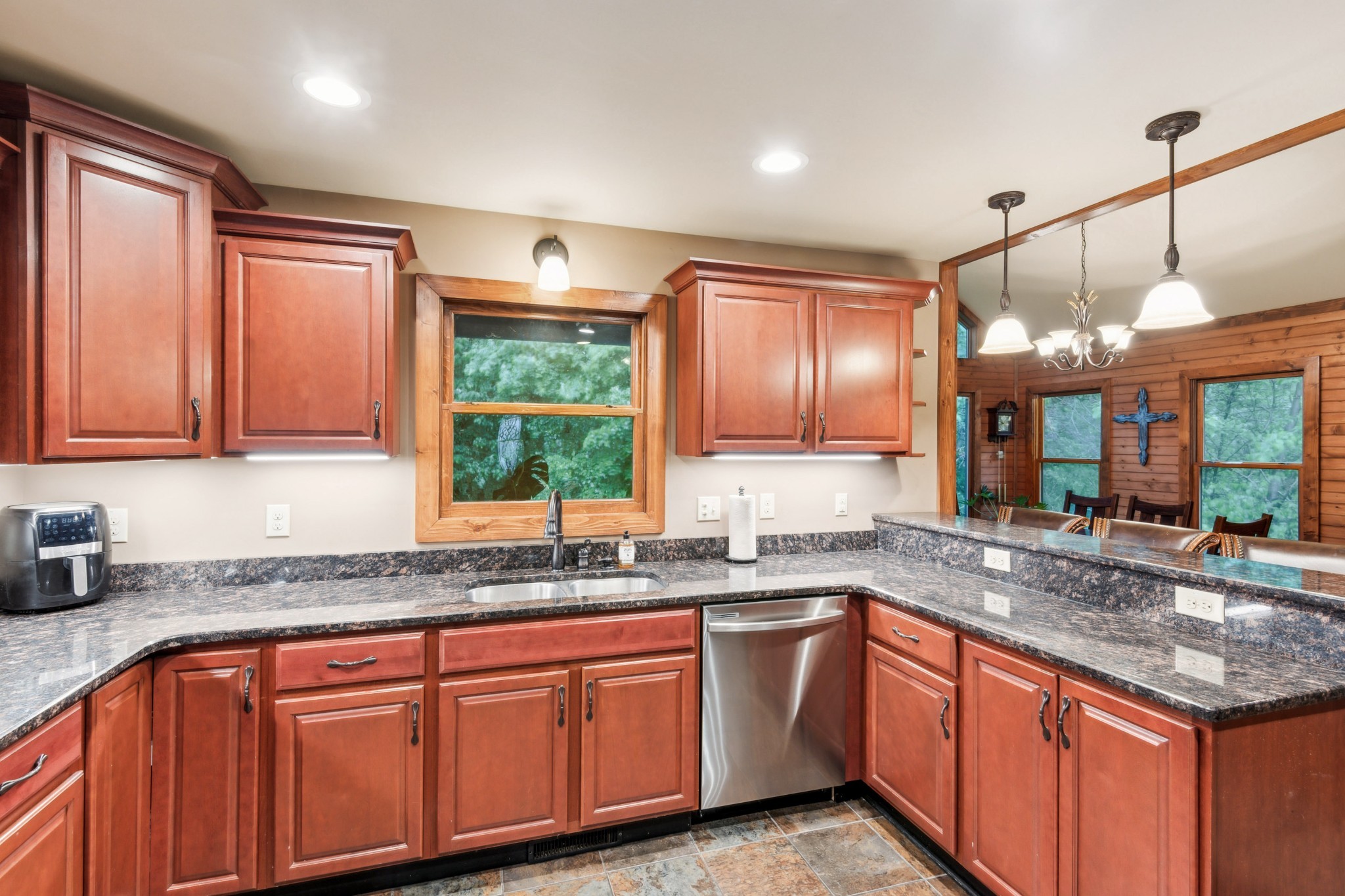 4455 Tarsus Road Palmyra, TN 37142 - Photo 19 of 38 a kitchen with granite countertop cabinets a sink and a window