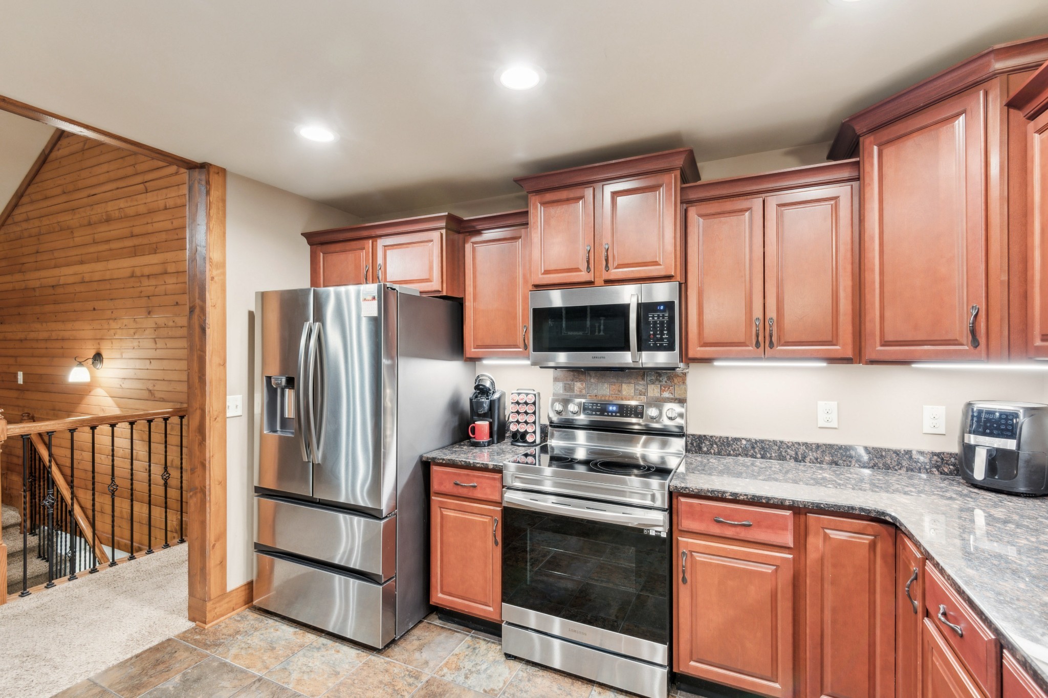 4455 Tarsus Road Palmyra, TN 37142 - Photo 20 of 38 a kitchen with stainless steel appliances granite countertop a refrigerator stove microwave and sink