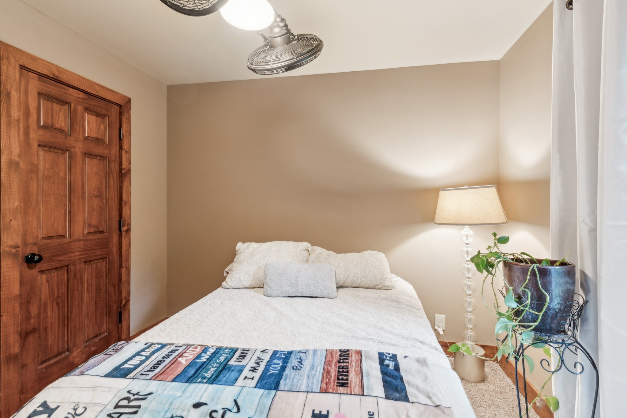 4455 Tarsus Road Palmyra, TN 37142 - Photo 23 of 38 a bedroom with a bed and a lamp