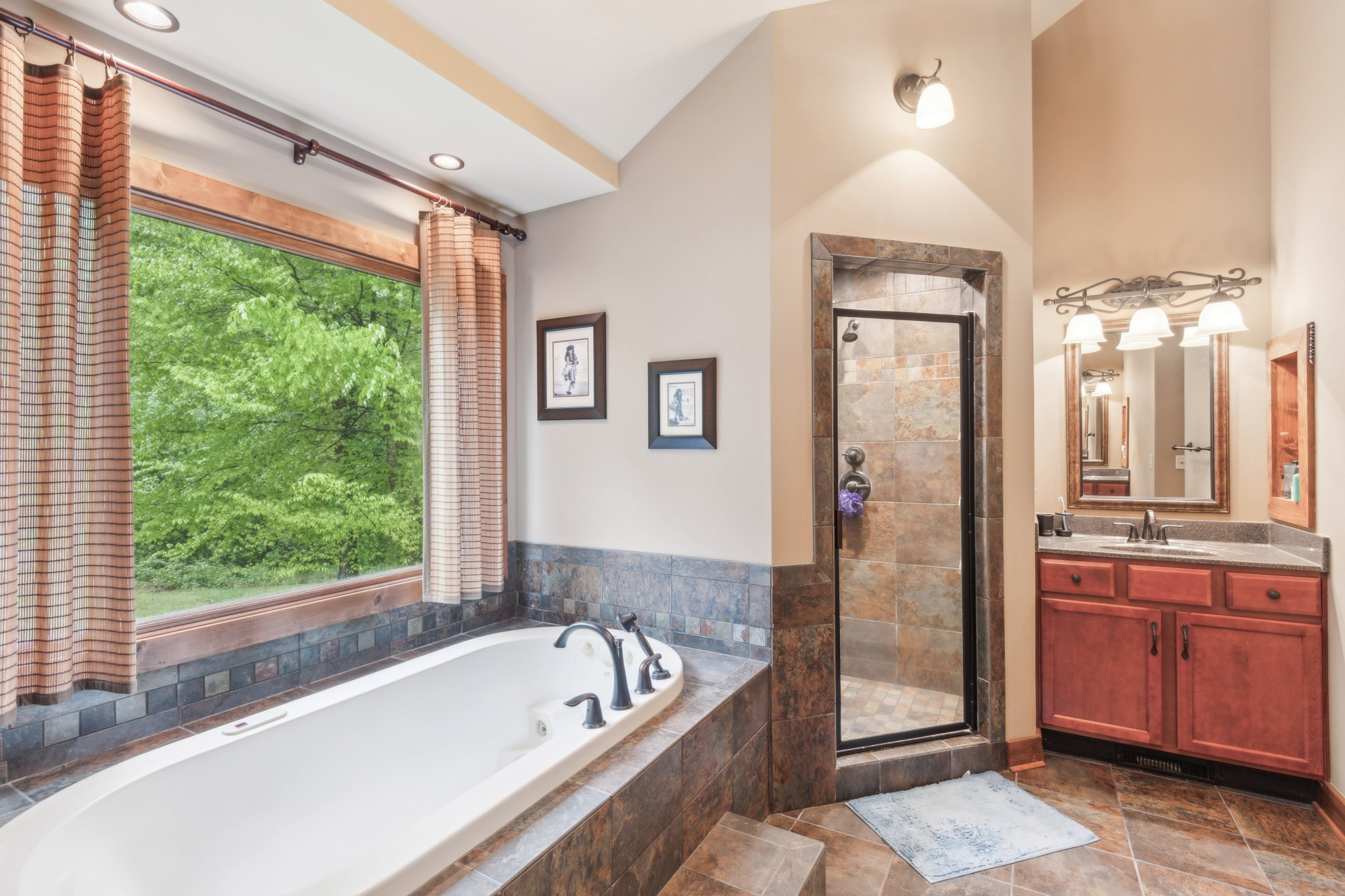 4455 Tarsus Road Palmyra, TN 37142 - Photo 27 of 38 a bathroom with a tub a sink and a large window