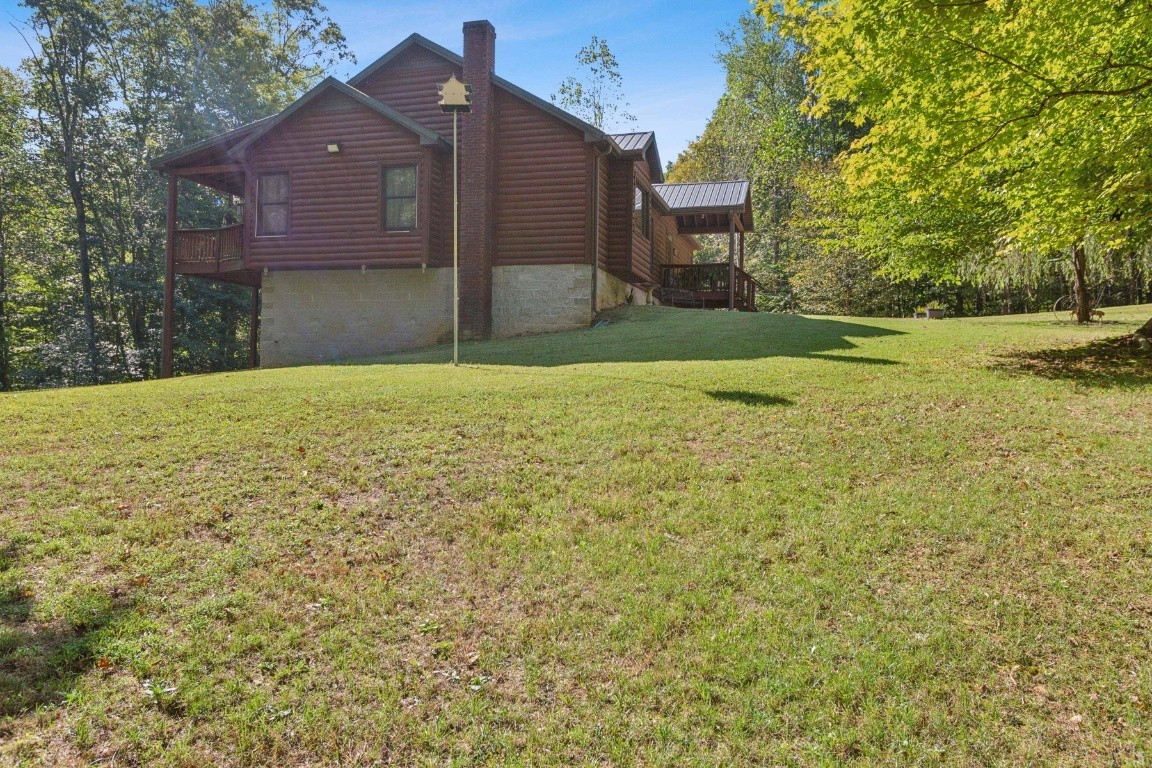4455 Tarsus Road Palmyra, TN 37142 - Photo 3 of 38 a house view with a outdoor space