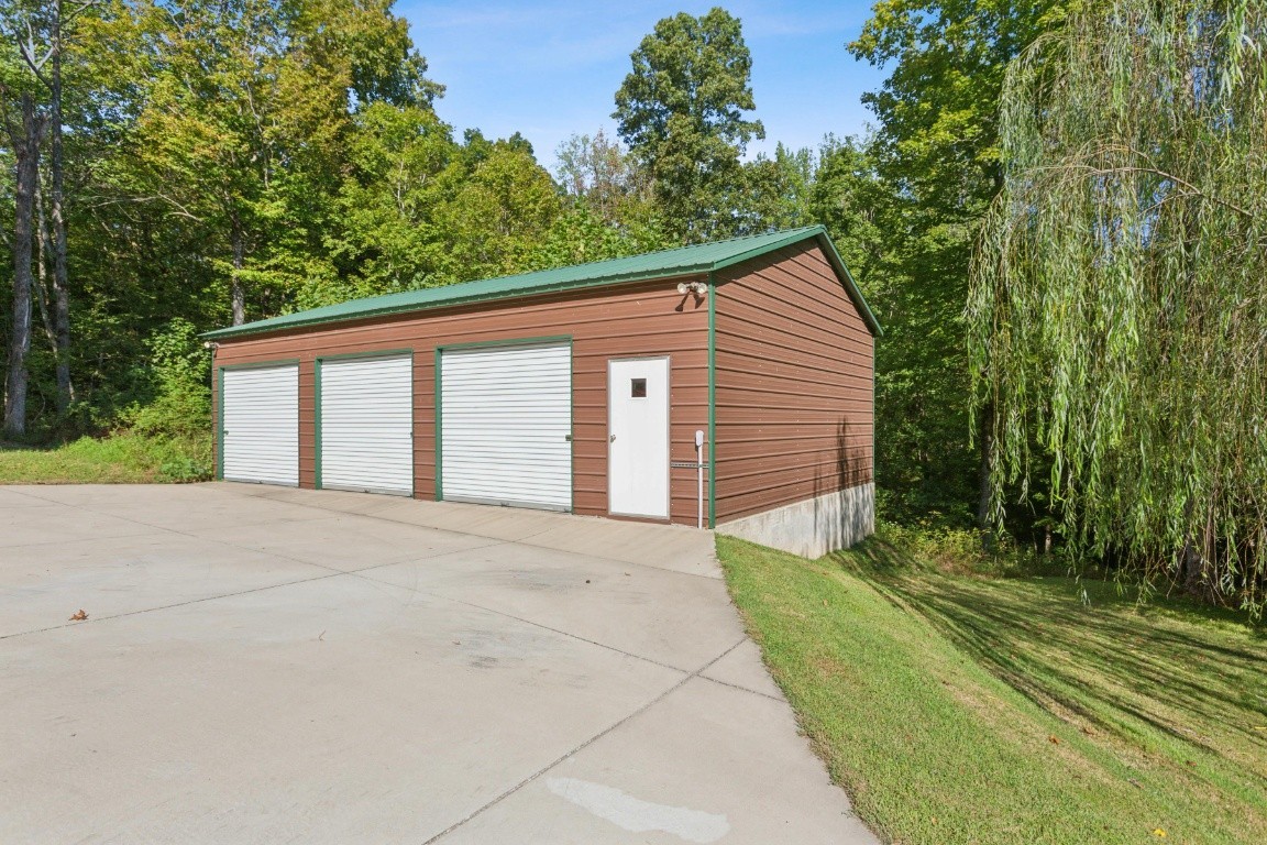 4455 Tarsus Road Palmyra, TN 37142 - Photo 5 of 38 a view of a house with a backyard