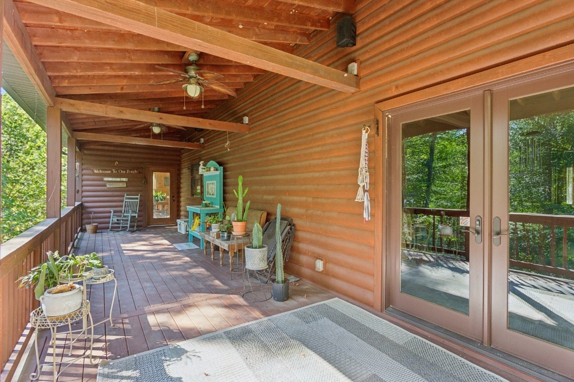 4455 Tarsus Road Palmyra, TN 37142 - Photo 7 of 38 a view of a patio with table and chairs and potted plants