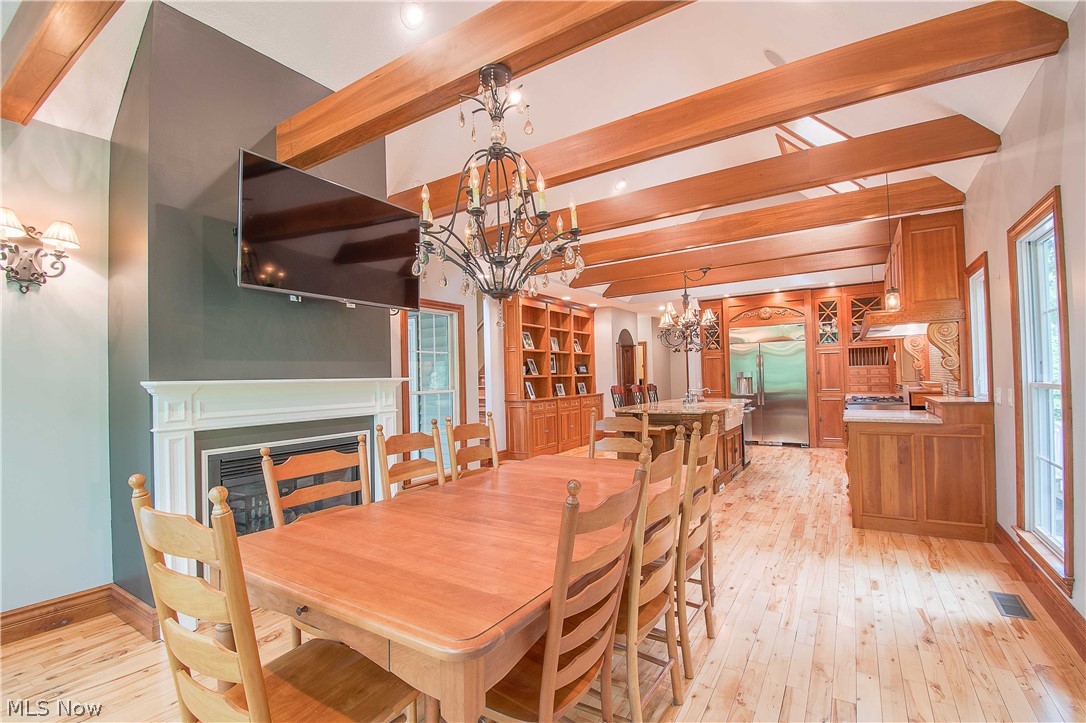 6868 River Styx Road Medina, OH 44256 - Photo 12 of 35 Stunning hand-built beams, hardwood floors and fireplace.