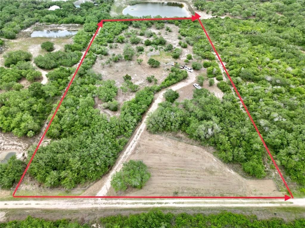 0 West Rhodes Avenue Aransas Pass, TX 78336 - Photo 6 of 11 a view of a yard with flower plants