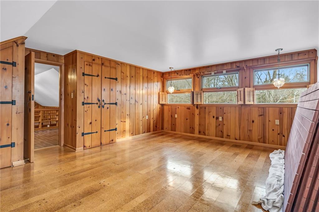 5802 Maple Way Jamestown, PA 16134 - Photo 13 of 24 a view of an empty room with wooden floor and a window