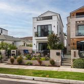 a front view of multiple houses with yard