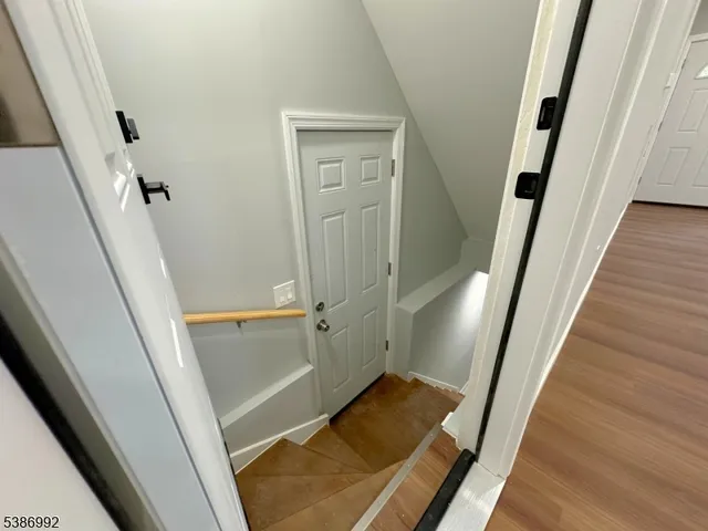 wooden floor with an entryway