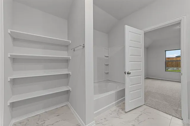 a view of an empty walk in closet