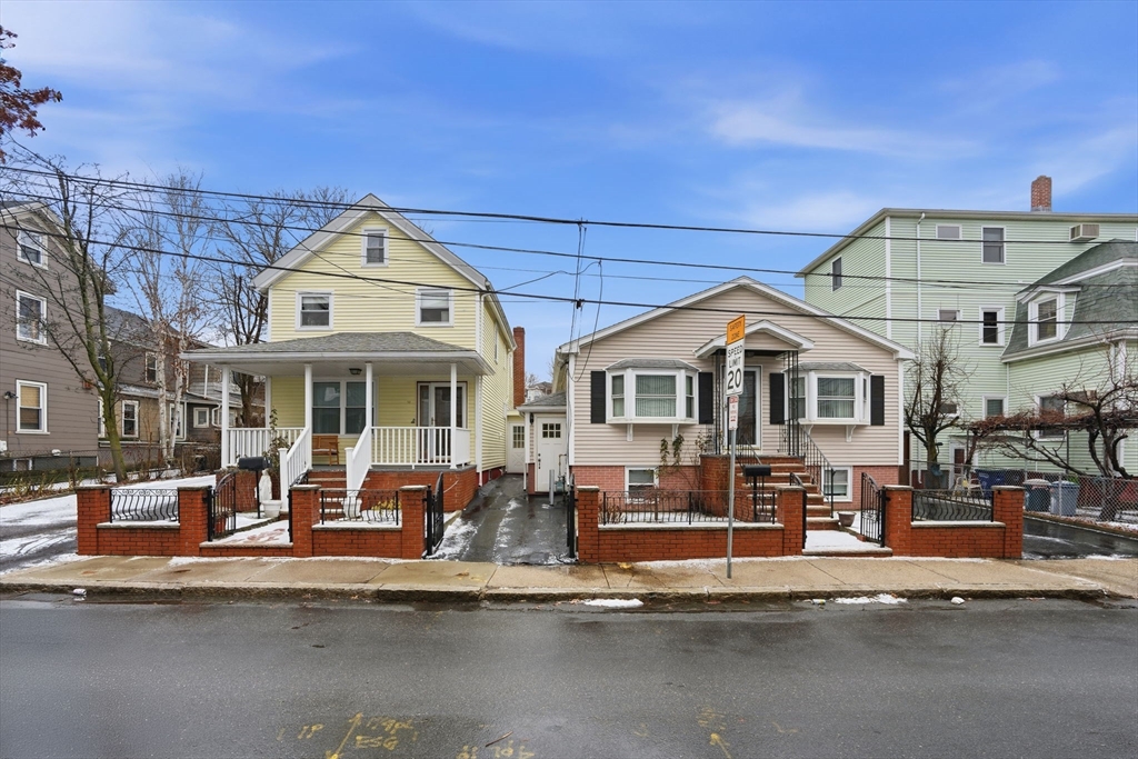 a front view of a building with a big yard