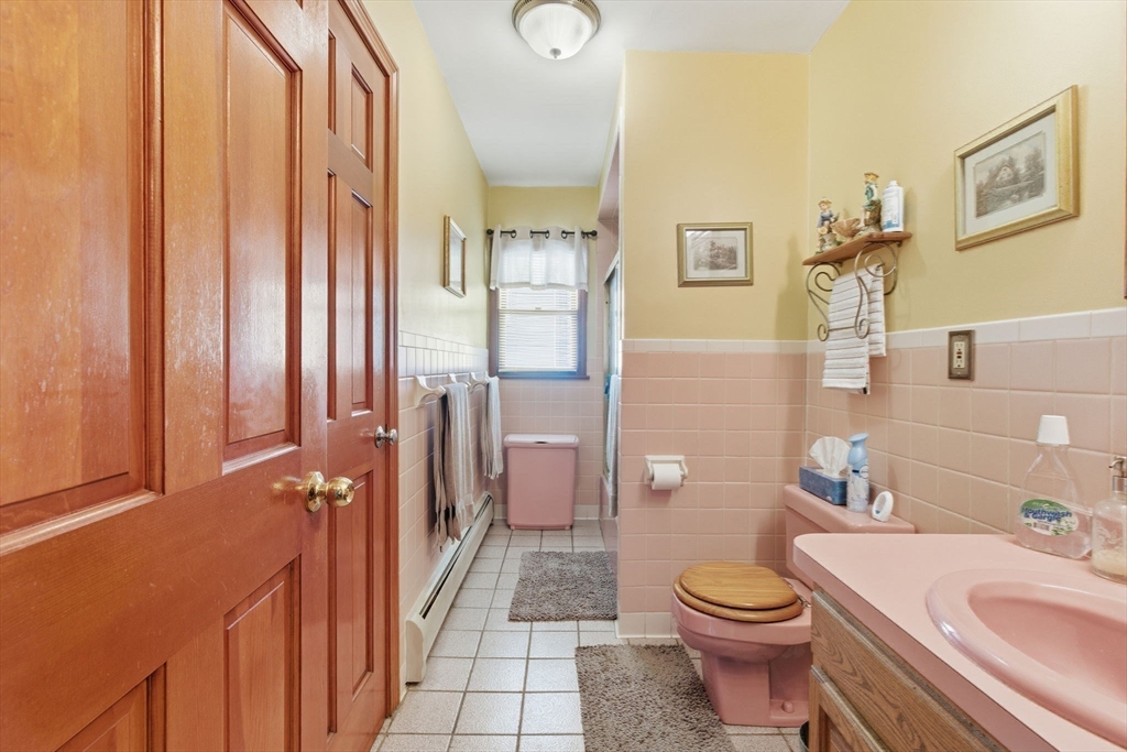 71-73 Oak Street Somerville, MA 02143 - Photo 15 of 42 a bathroom with a sink a toilet and shower