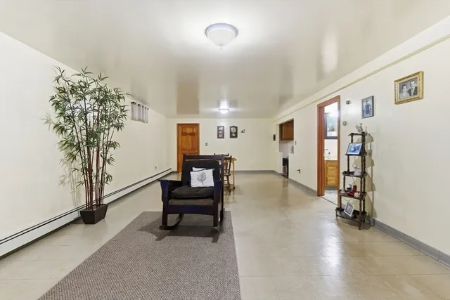 a view of a livingroom with furniture and a potted plant