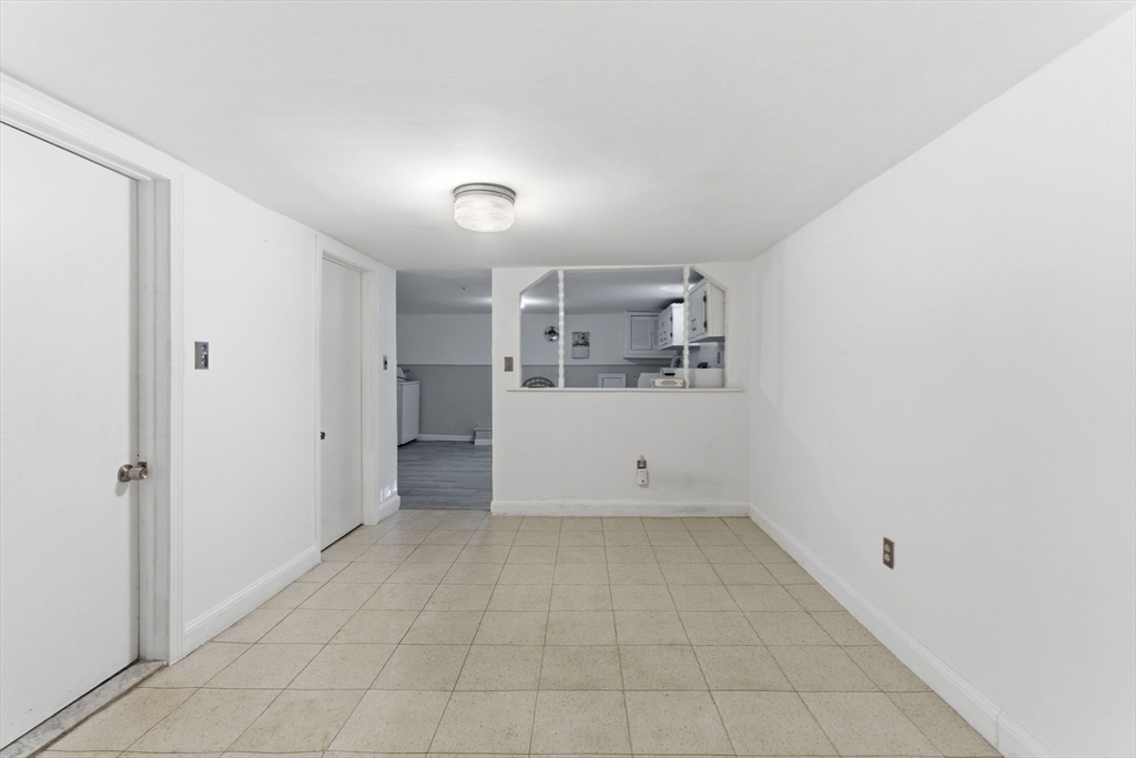 71-73 Oak Street Somerville, MA 02143 - Photo 23 of 42 a view of a kitchen with a sink and a refrigerator