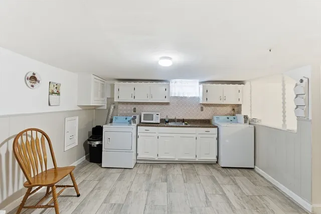 a kitchen with a cabinets and chairs
