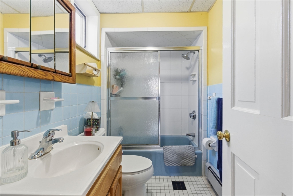 71-73 Oak Street Somerville, MA 02143 - Photo 27 of 42 a bathroom with a sink toilet and shower