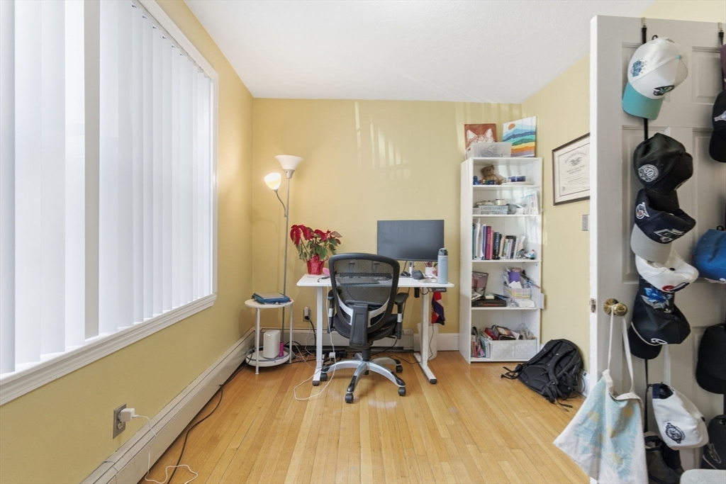 71-73 Oak Street Somerville, MA 02143 - Photo 30 of 42 a view of a workspace with furniture and a window
