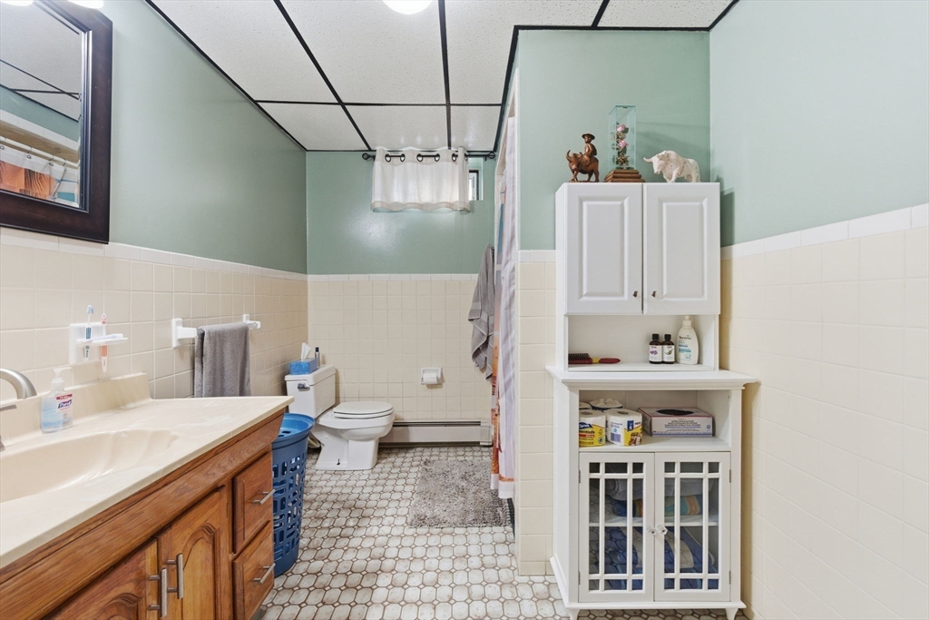 71-73 Oak Street Somerville, MA 02143 - Photo 33 of 42 a bathroom with a sink a toilet and shower
