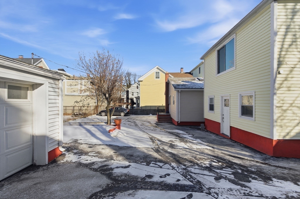 71-73 Oak Street Somerville, MA 02143 - Photo 34 of 42 a view of a houses with backyard