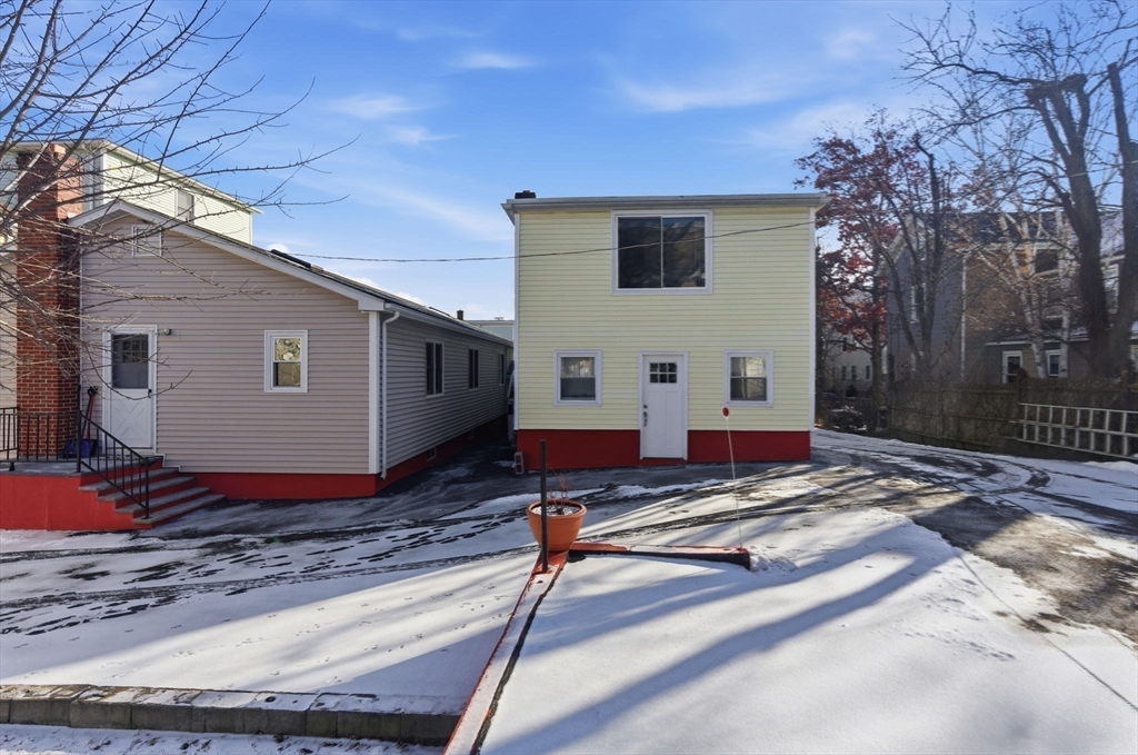 71-73 Oak Street Somerville, MA 02143 - Photo 35 of 42 a view of house with backyard