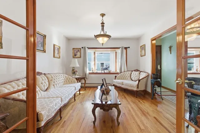 a view of a livingroom with furniture window and wooden floor