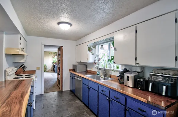a kitchen with counter top space cabinets and stainless steel appliances