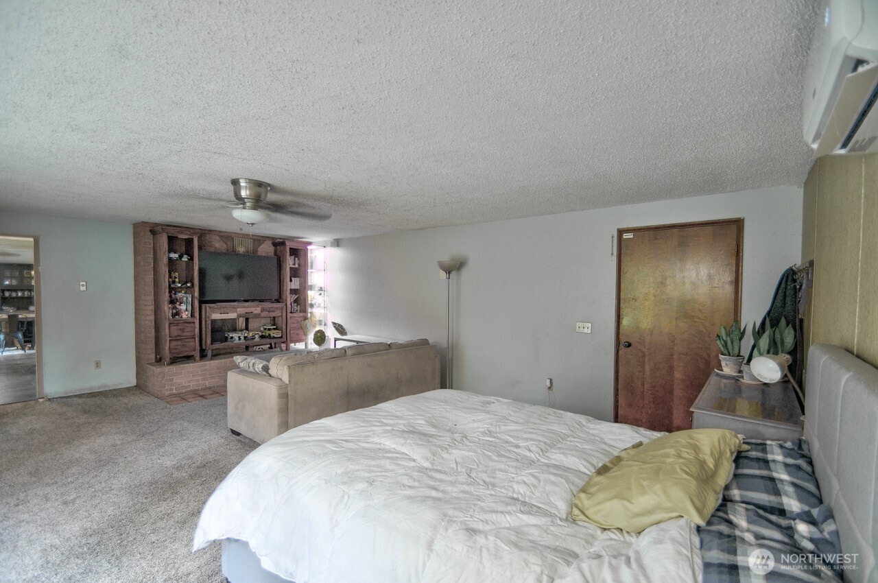 8548 178th Avenue Southwest Rochester, WA 98579 - Photo 16 of 30 a bed room with a bed and furniture