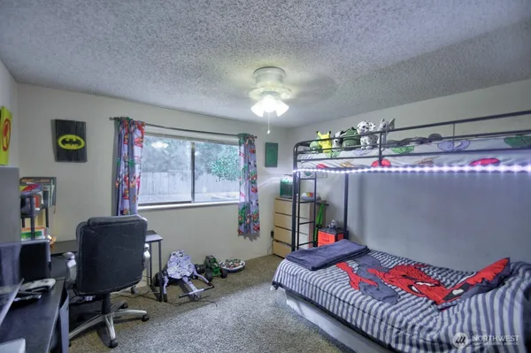 a bedroom with a workspace