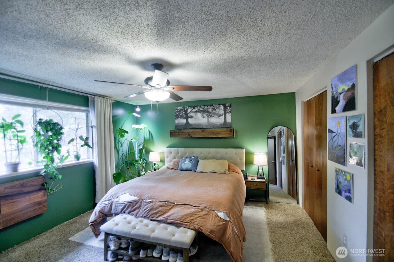 8548 178th Avenue Southwest Rochester, WA 98579 - Photo 24 of 30 a bedroom with a bed window and a potted plant