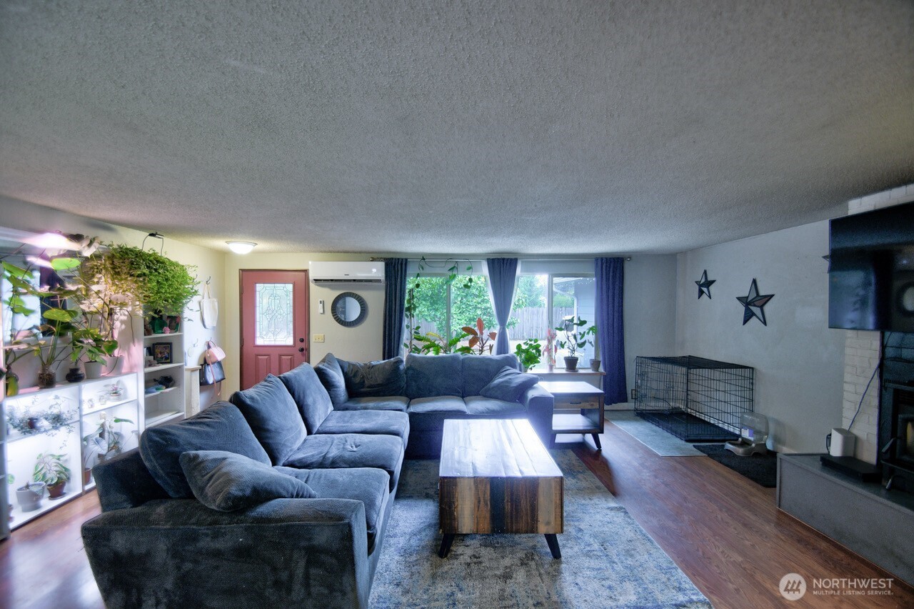 8548 178th Avenue Southwest Rochester, WA 98579 - Photo 5 of 30 a living room with furniture and a large window