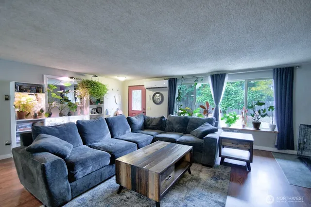 a living room with furniture and a large window