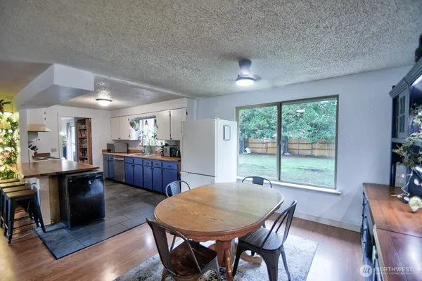 a view of a dining room with furniture window and wooden floor