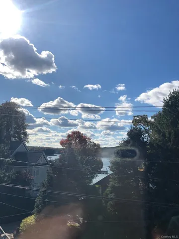 a view of swimming pool outdoor seating and city view