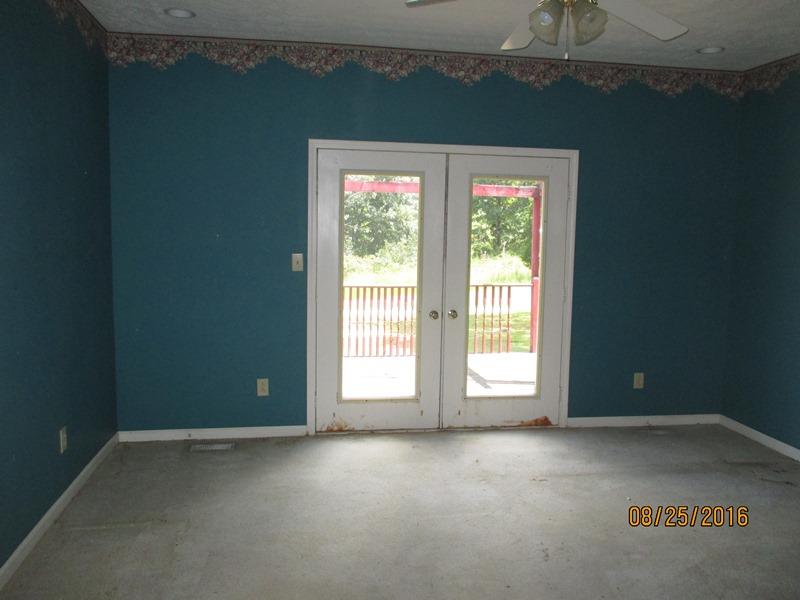 5101 Logan Road Cunningham, TN 37052 - Photo 5 of 8 an empty room with a window