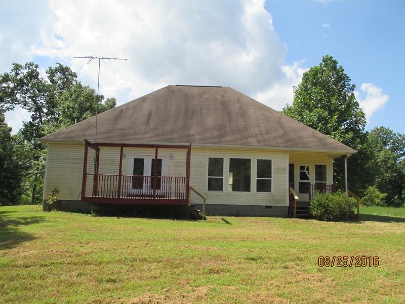 5101 Logan Road Cunningham, TN 37052 - Photo 8 of 8 front view of a house with a yard