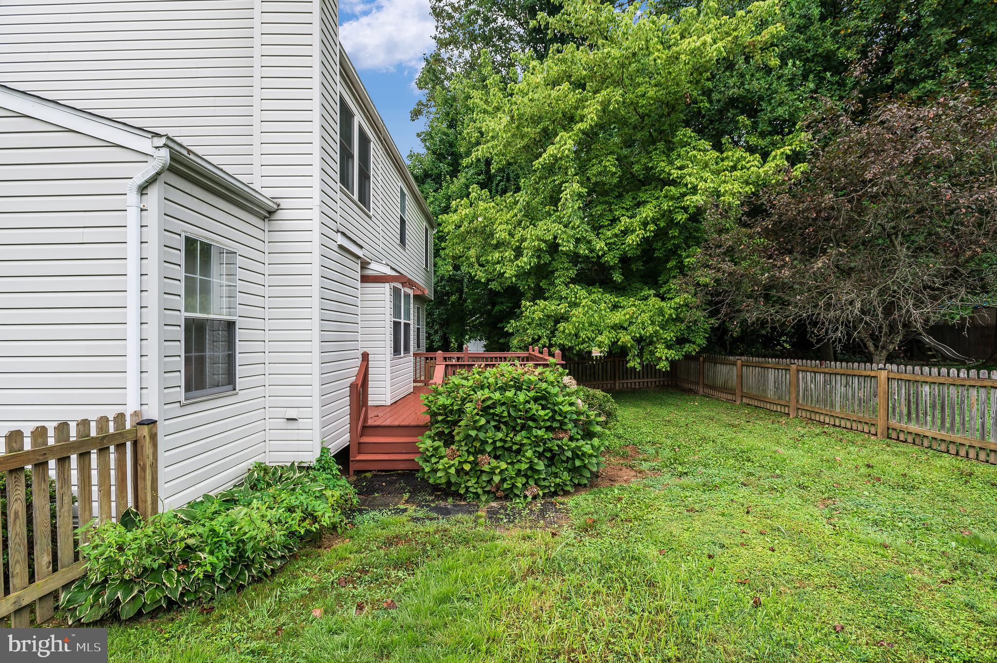 47 Church Road Owings Mills, MD 21117 - Photo 3 of 29 Fenced in backyard with wood deck.