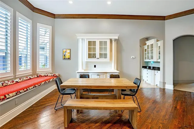a dining room with a table and chairs