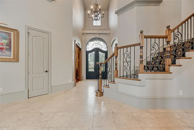 a view of entryway and hallway with a front door